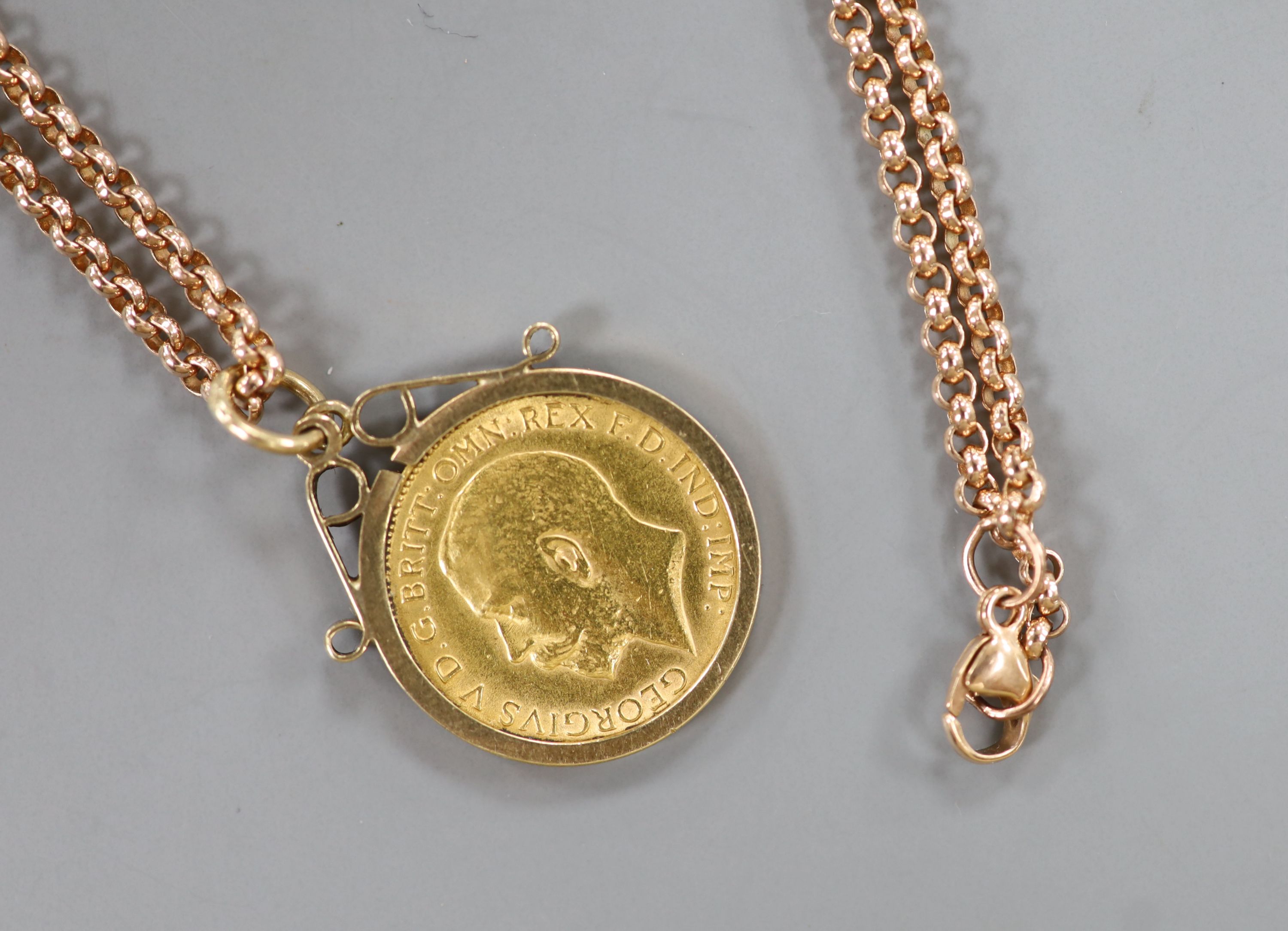 A 1914 half sovereign in 9ct gold mount on 9ct gold belcher chain